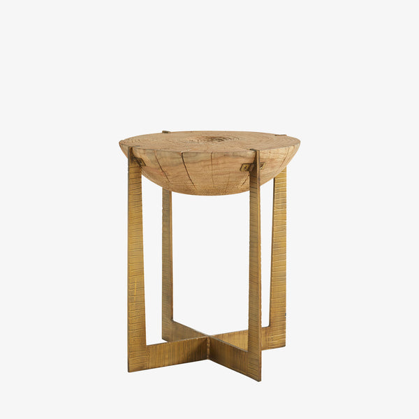 Round rustic wood end table with brass toned iron frame base on a white background
