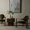 Four hands brand Bria chair in surrey olive velvet in a moody living space