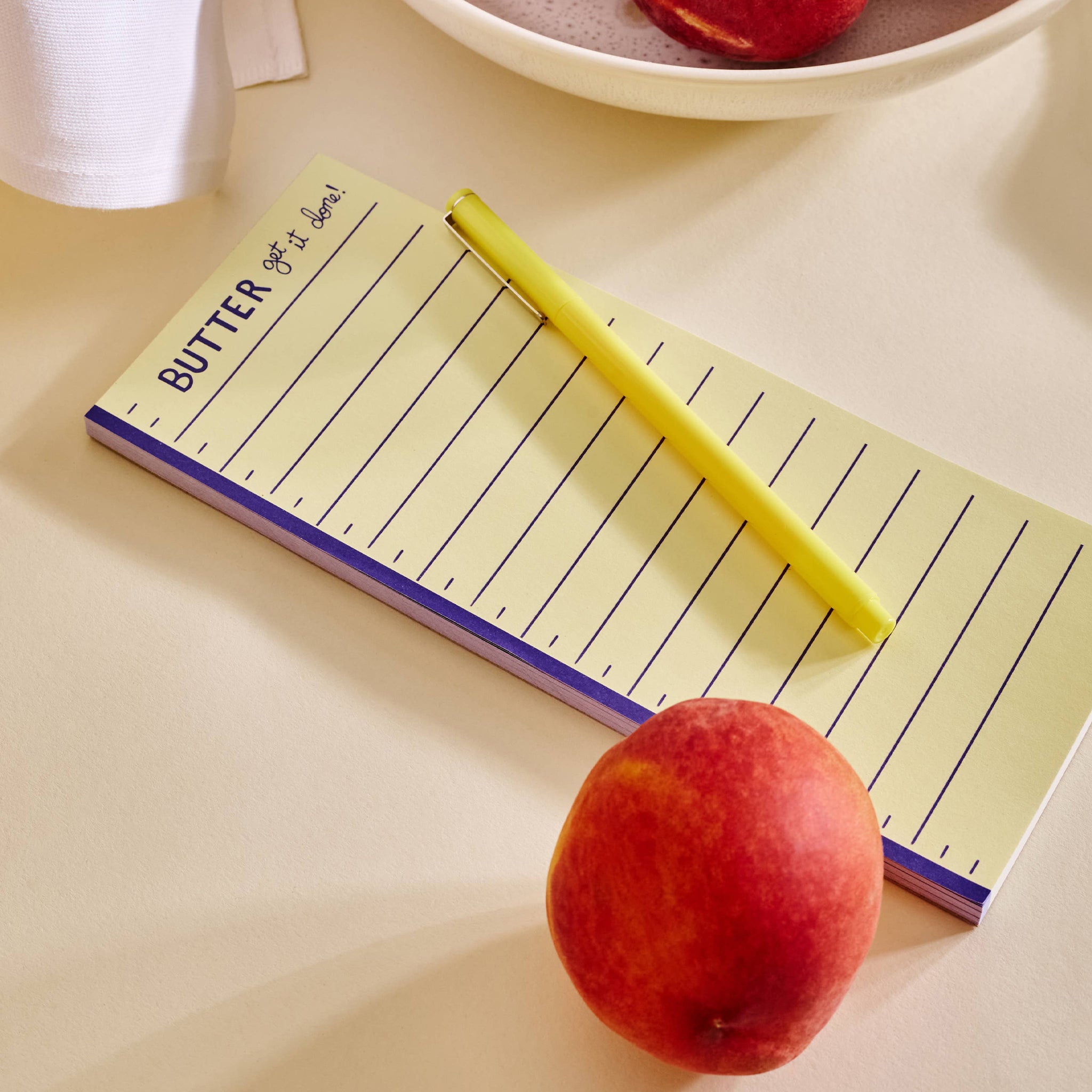 Butter Get It Done Notepad on a beige table at Addison West