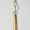 Close up of Capsa 17x29 Antique Gold and Silver Toned Metal Dome Pendant Light on a white background