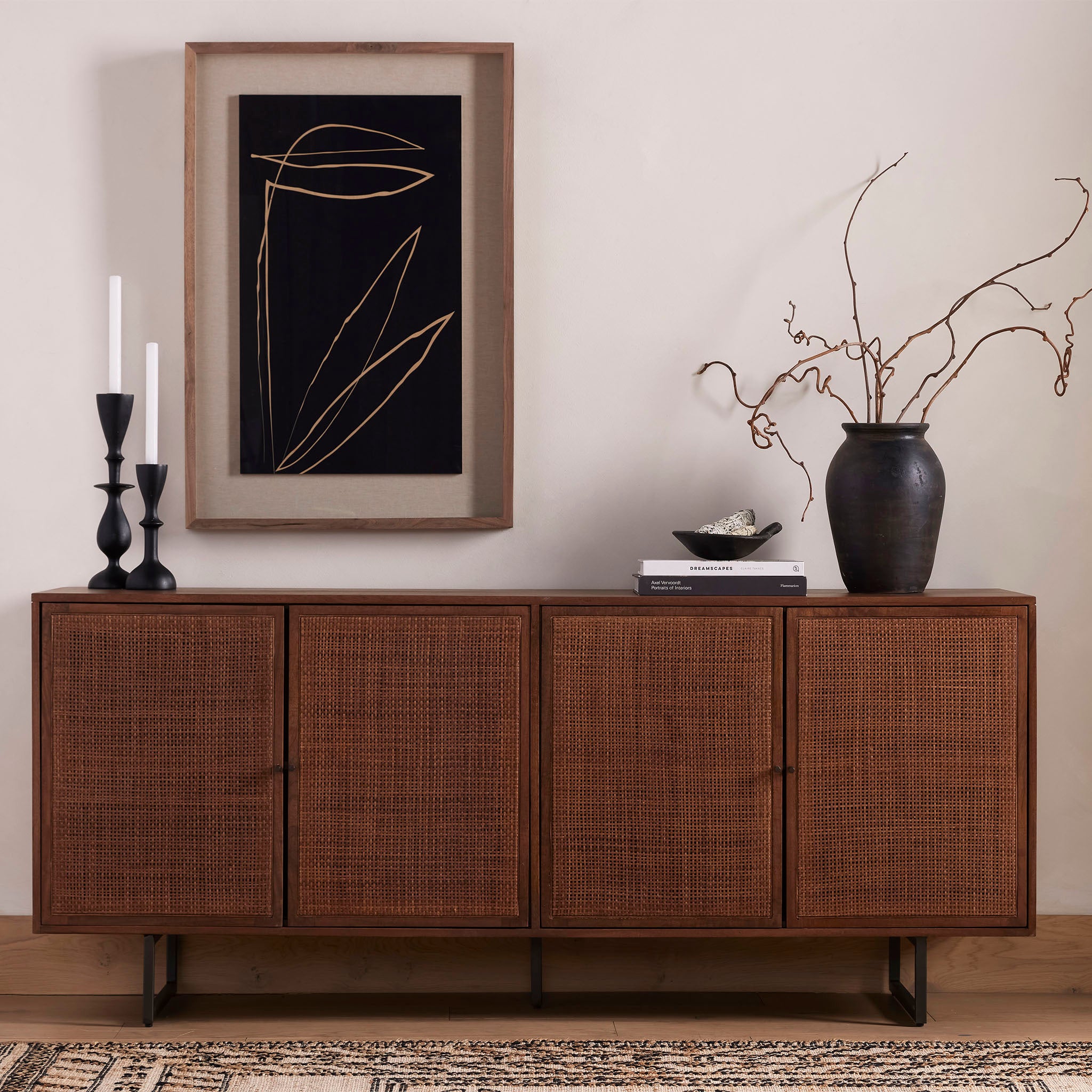 Four Hands furniture brand Carmel side board with four cane doors and metal legs. on a white background