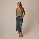 Carve Atlas Denim Skirt in Favorite Fade as shown on female model on plain background.