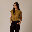 Astrid Hemp Tee in Golden Stripe shown on model on plain background.