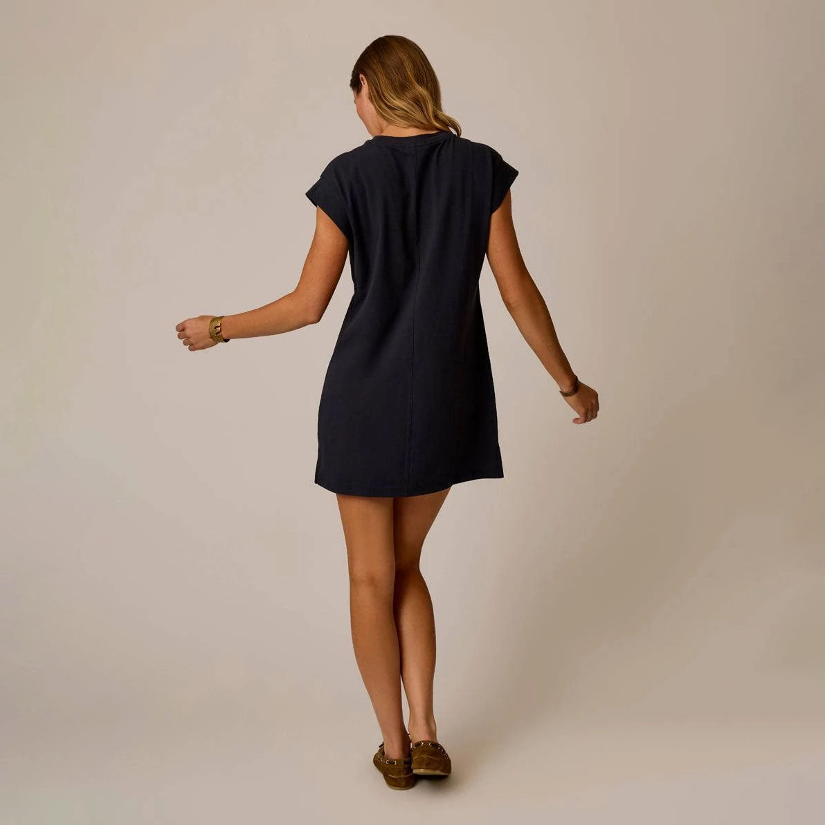 Cosmo Dress in Black shown on model on plain background.