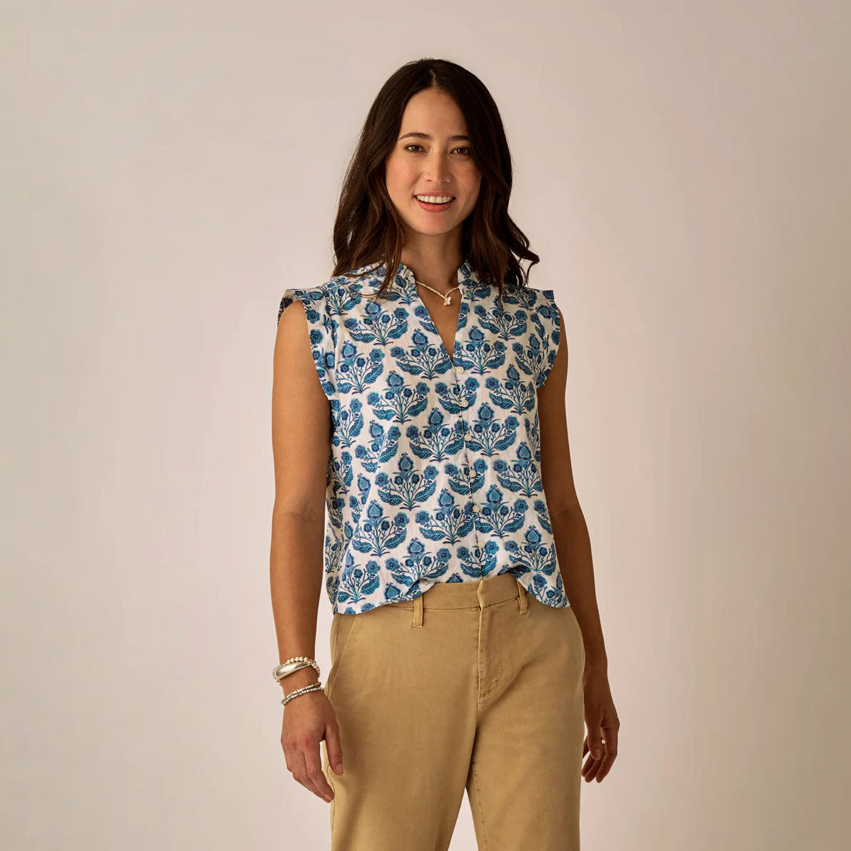 Reagan Top in Folk Floral shown on model on plain background.
