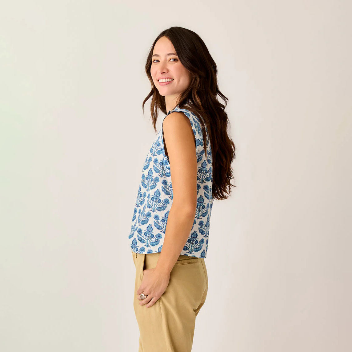 Reagan Top in Folk Floral shown on model on plain background.