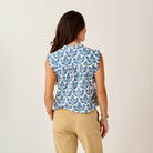 Reagan Top in Folk Floral shown on model on plain background.