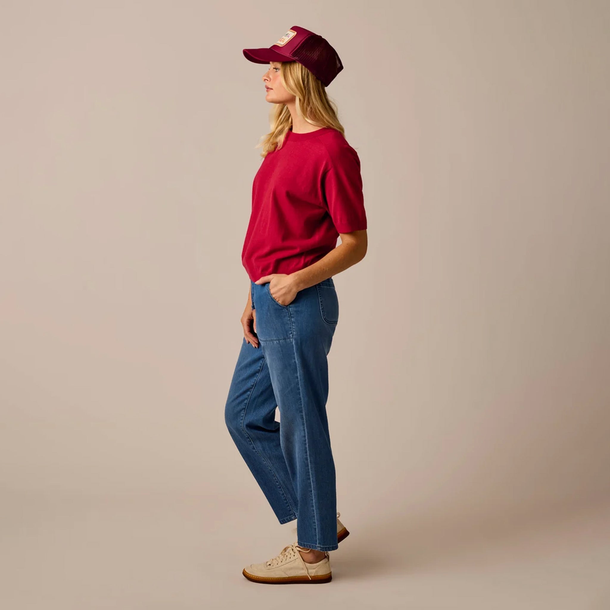 Female model shown wearing the Carve Josie Sweater Tee in Crimson on plain background.