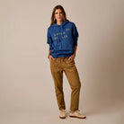 Female model shown wearing the Carve Zoe Twill Pant in Walnut on plain background.