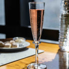 Simon Pearce Cavendish Champagne Flute on a table at Addison West