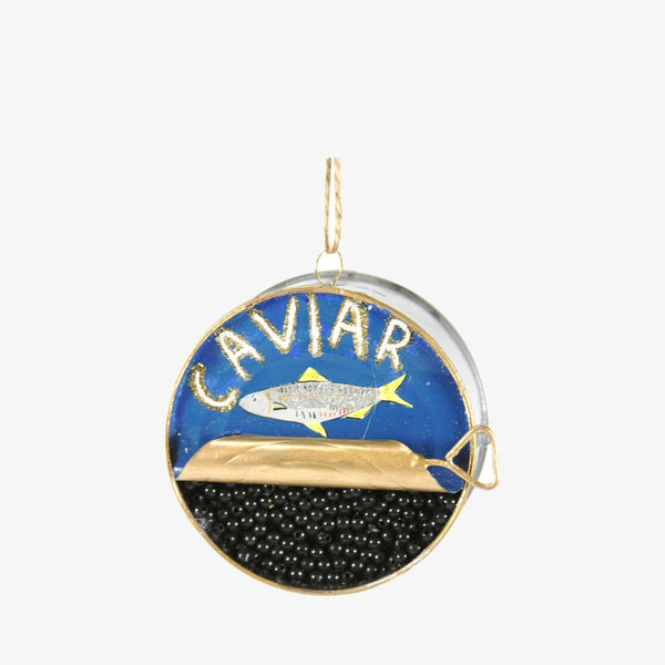 Tin of blue and gold caviar Christmas tree ornament by Cody Foster on white background