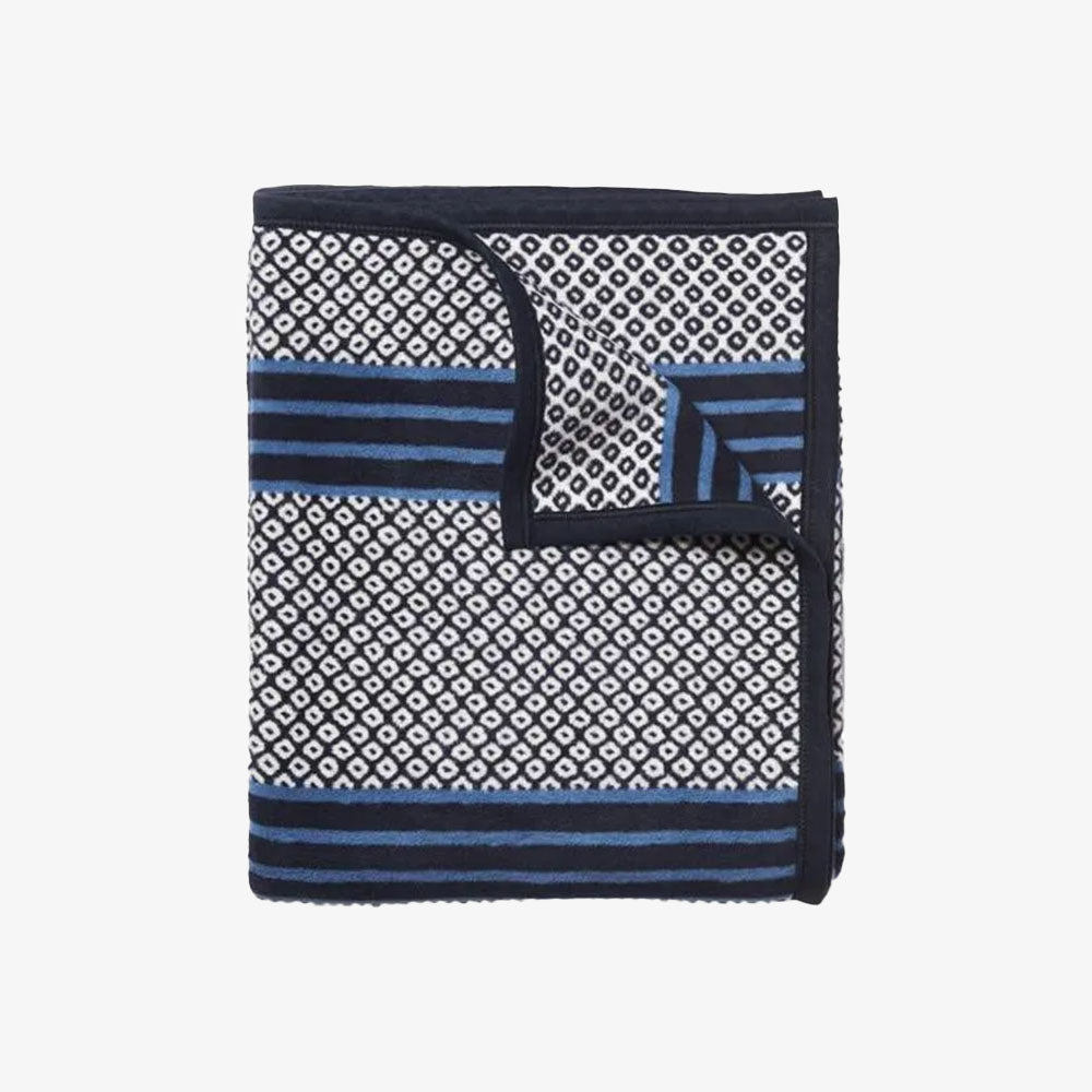 Chappy wrap blue patterned captain's blanket on a white background