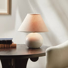 Charlie Mini Lamp in White on a table at Addison West