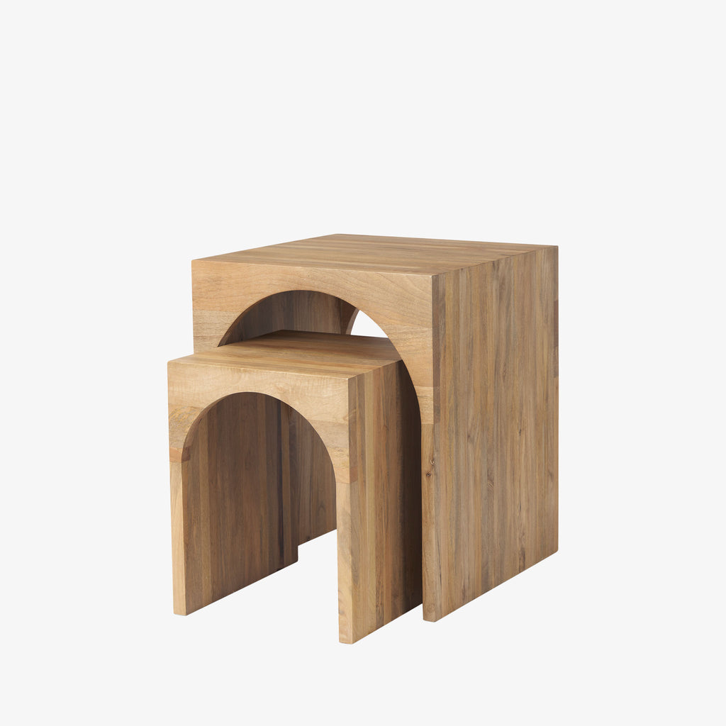 Set of two mangowood nesting tables with arch cut out on a white background