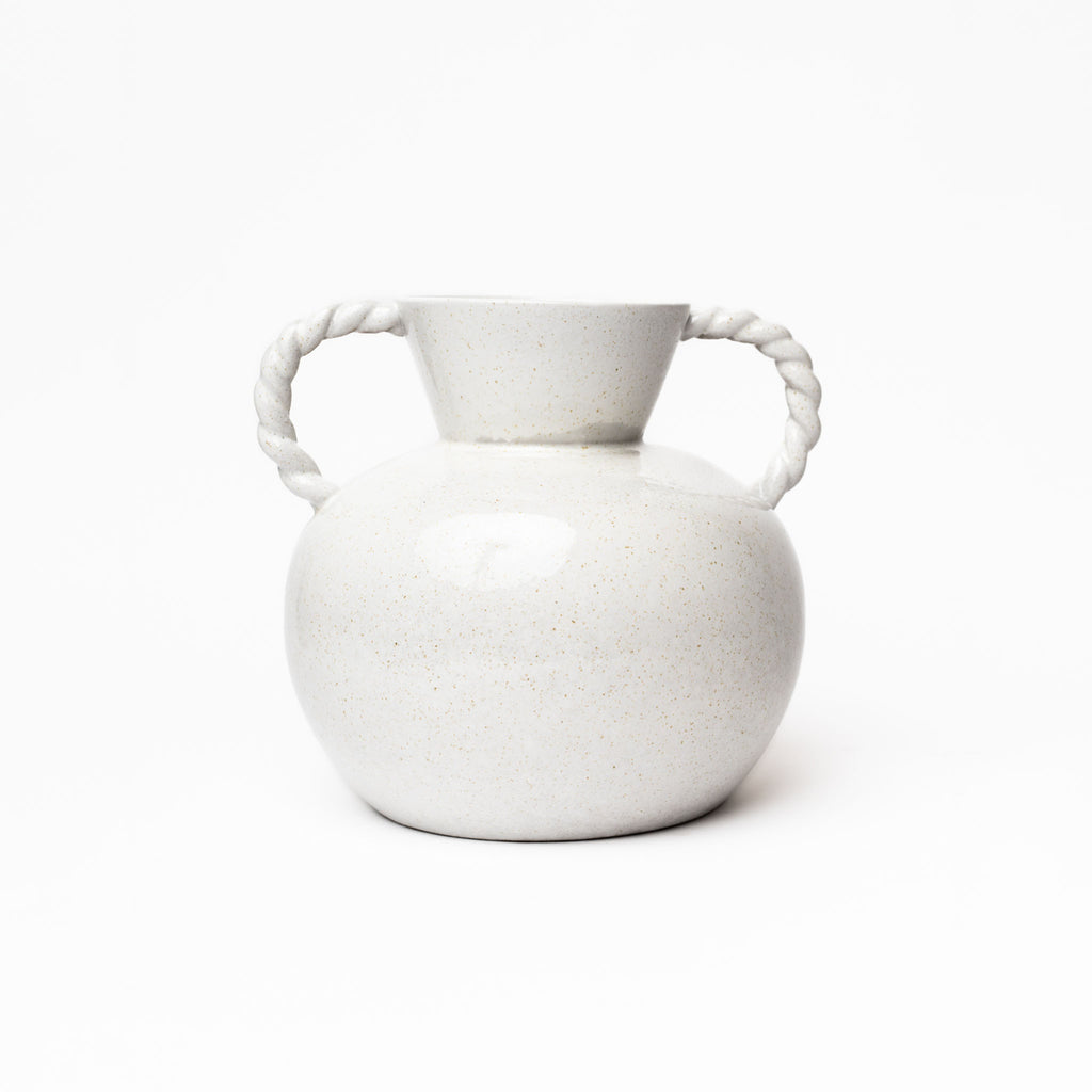 White round vase with two twisted handles on a white background