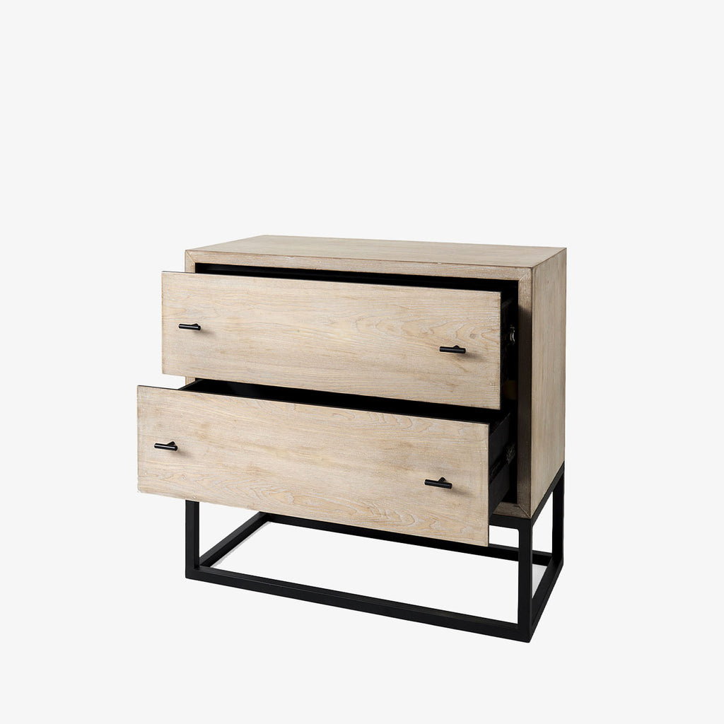 Cabinet with two drawers in white washed wood and black metal base on a white background