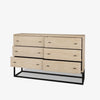 White washed wood six drawer dresser with metal base on a white background