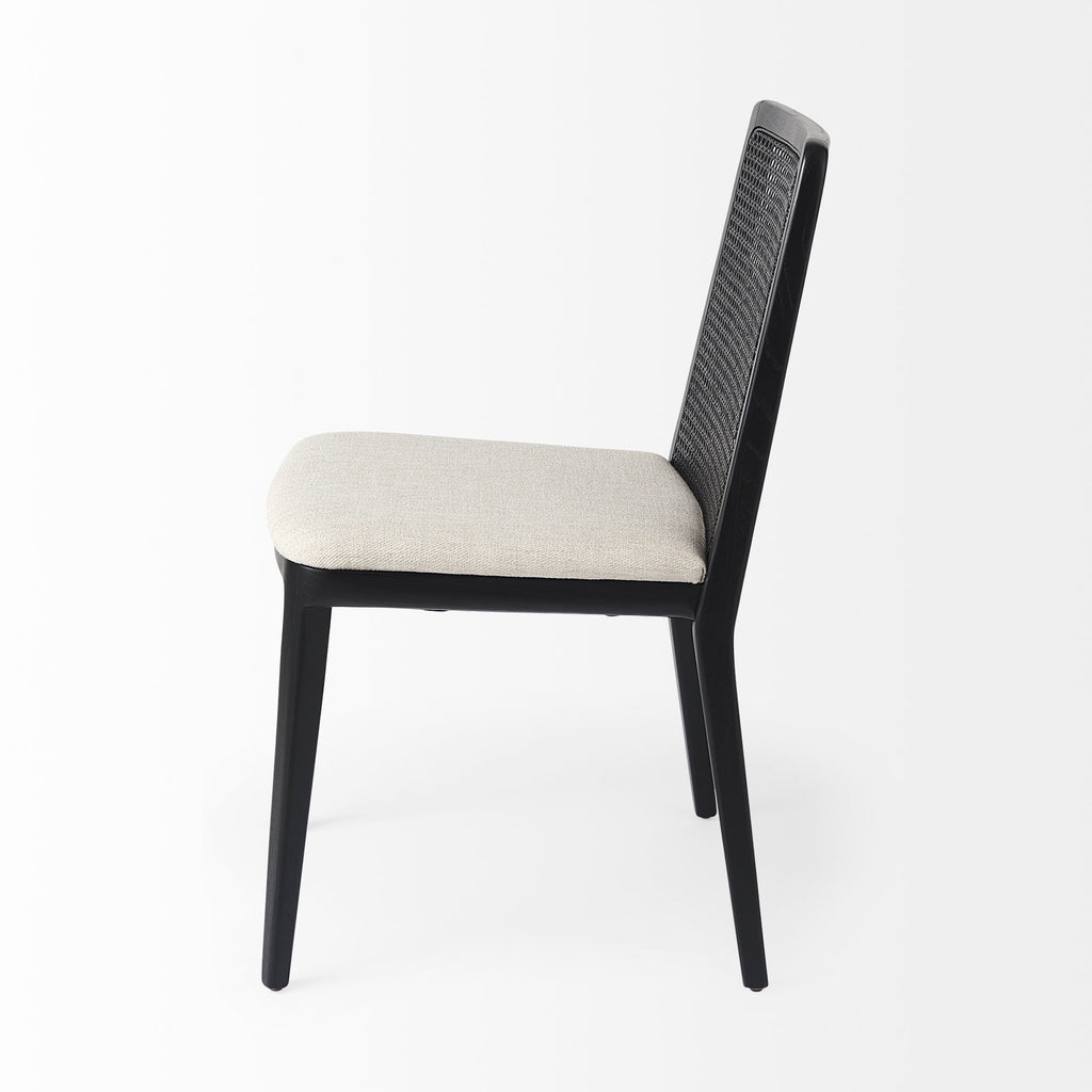 Clara Black Wood W/ Cream Fabric Seat and Cane Back Armless Dining Chair on a white background
