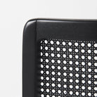 Close up of Clara Black Wood W/ Cream Fabric Seat and Cane Back Armless Dining Chair on a white background