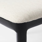 Clara Black Wood W/ Cream Fabric Seat and Cane Back Armless Dining Chair on a white background