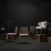 Collection of dining chairs against a black and grey  background