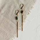 Commonform Passerine Earrings in Turquoise on textured background at the Addison West.