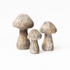 Three Cast Concrete Mushrooms on a white background