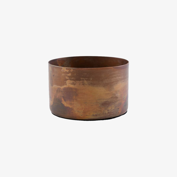 Society of lifestyle brand copper tea light holder on a white background