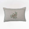 Lumbar throw pillow with embroidered pine cones and greenery