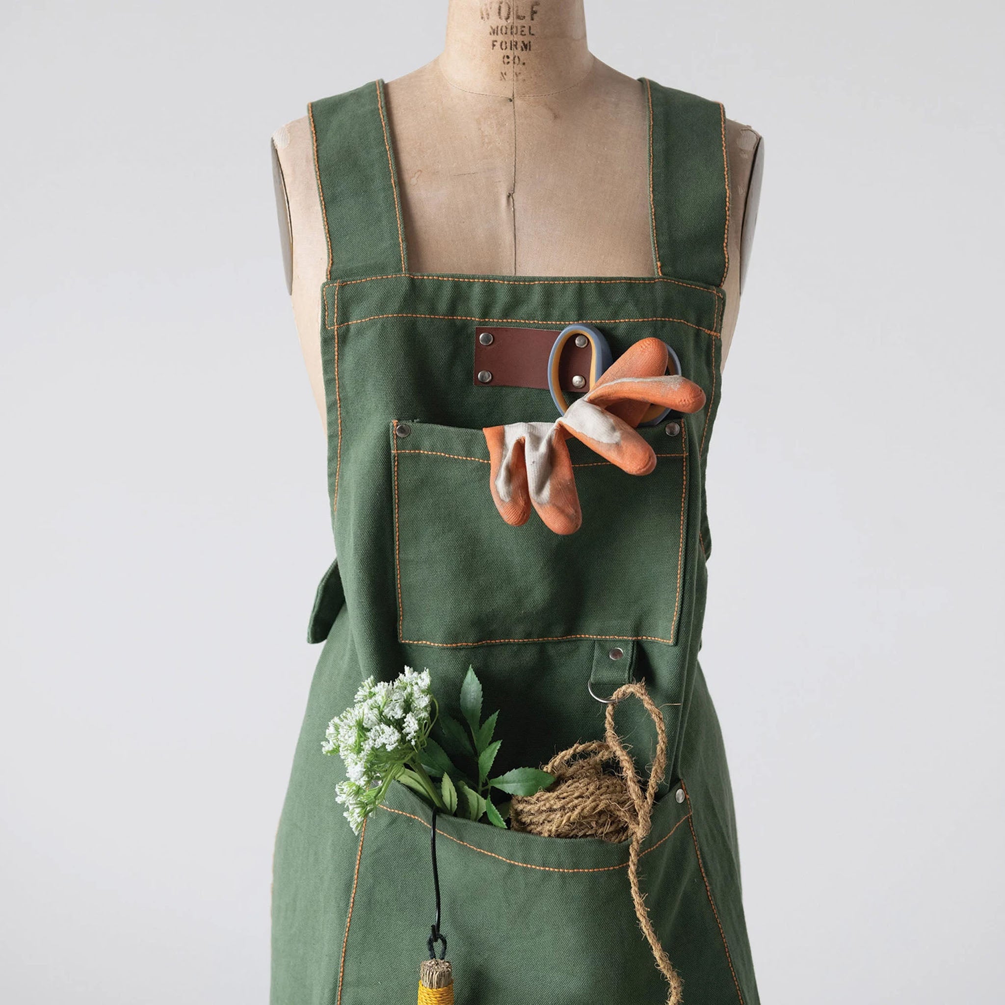Cross Back Apron with Pockets and Rivets on a white background at Addison West
