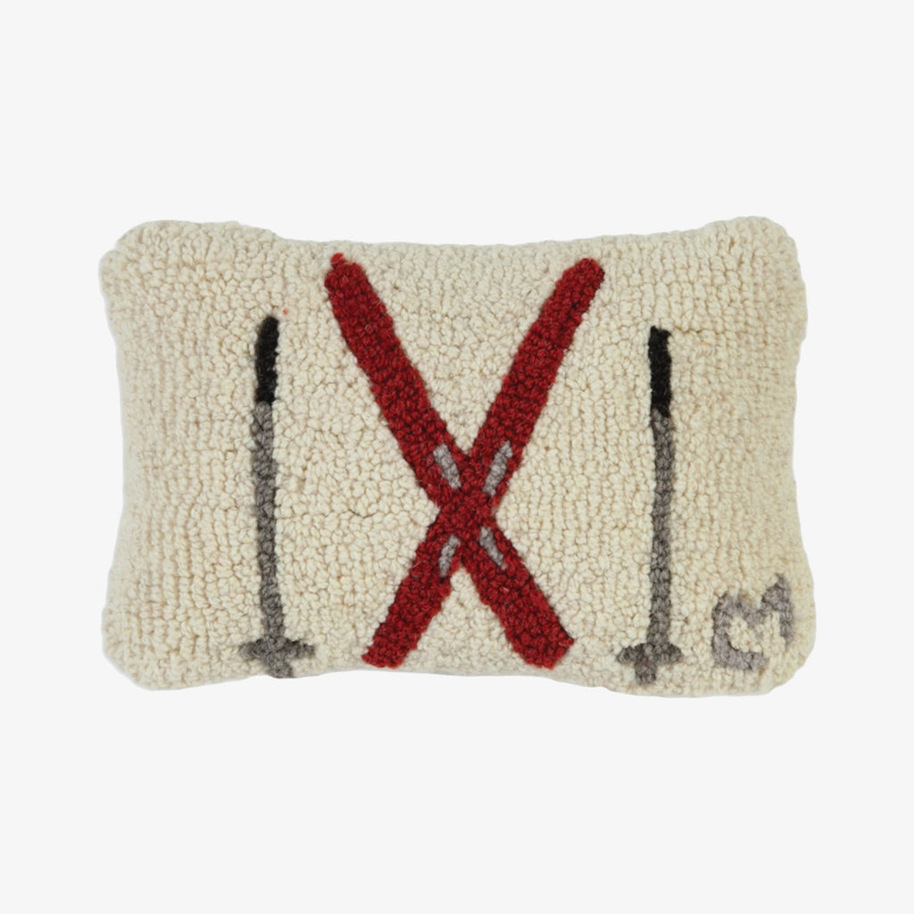 Chandler four corners brand hand hooked pillow with crossed skis and poles on a white background