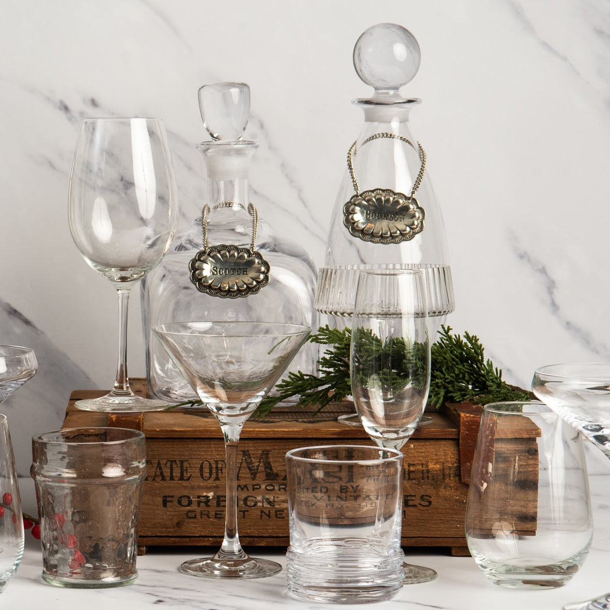 Scotch and Bourbon Pewter Western Decanter Tag on bottles on a white background at Addison West