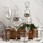 Scotch and Bourbon Pewter Western Decanter Tag on bottles on a white background at Addison West