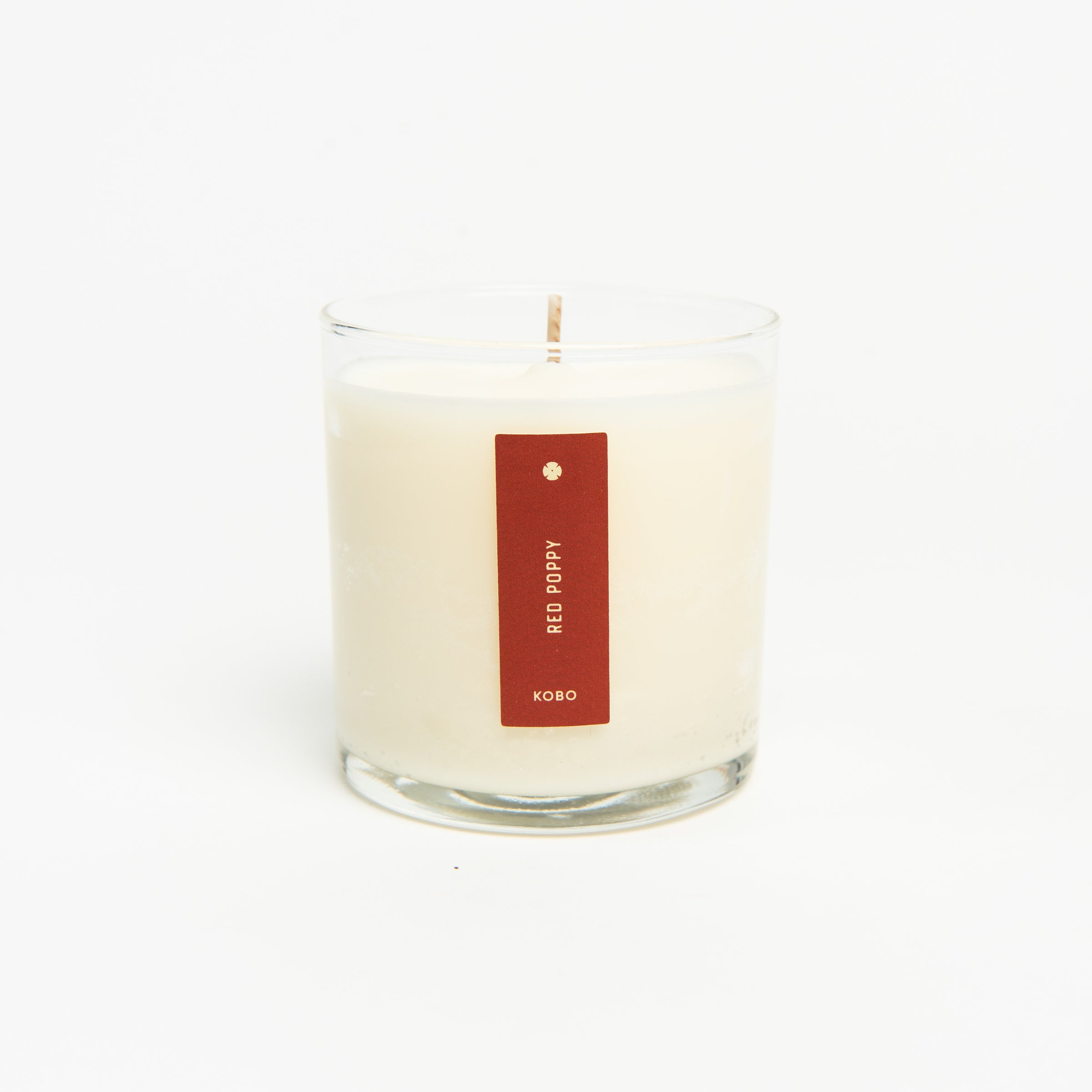 Red Poppy Candle on a white background at Addison West