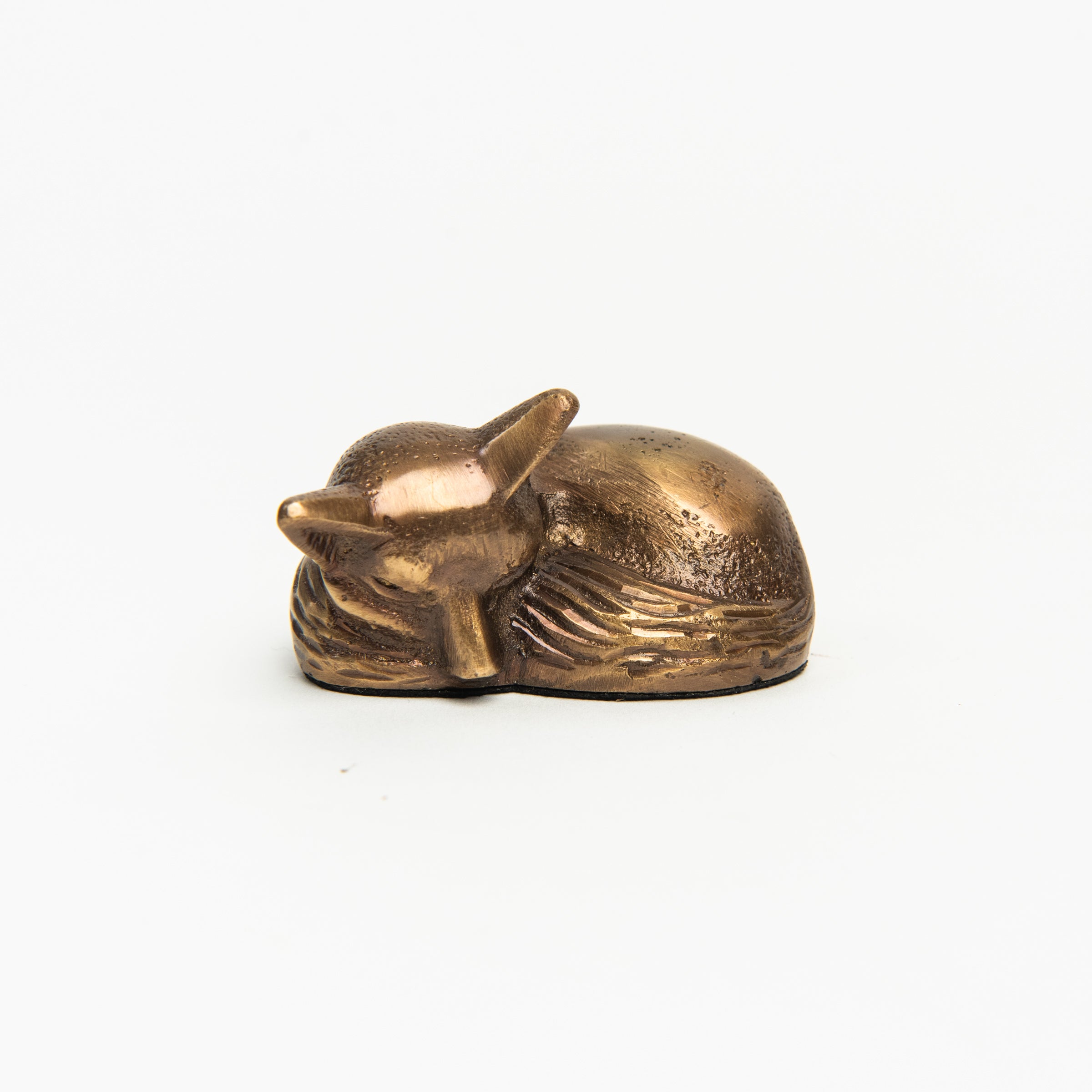 Antiqued Brass Sleeping Fox on a white background at Addison West