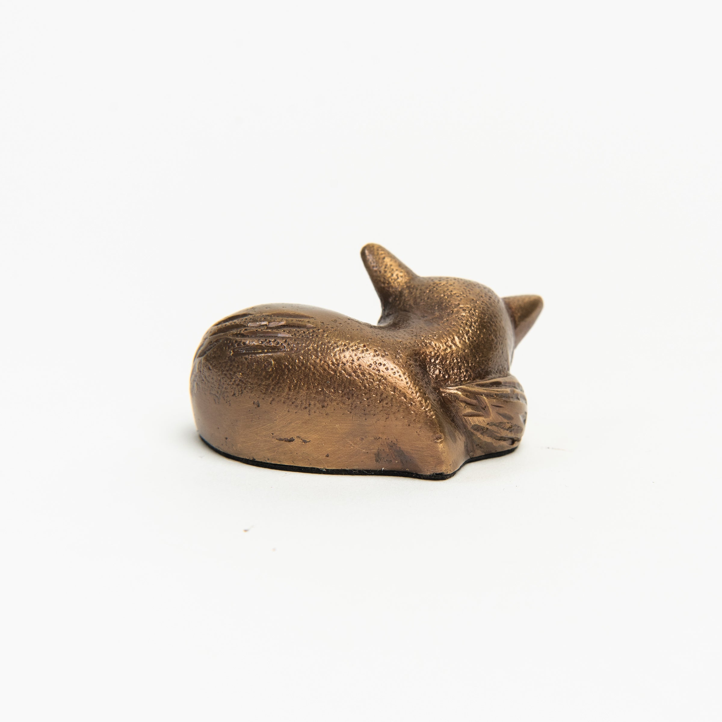 Antiqued Brass Sleeping Fox on a white background at Addison West