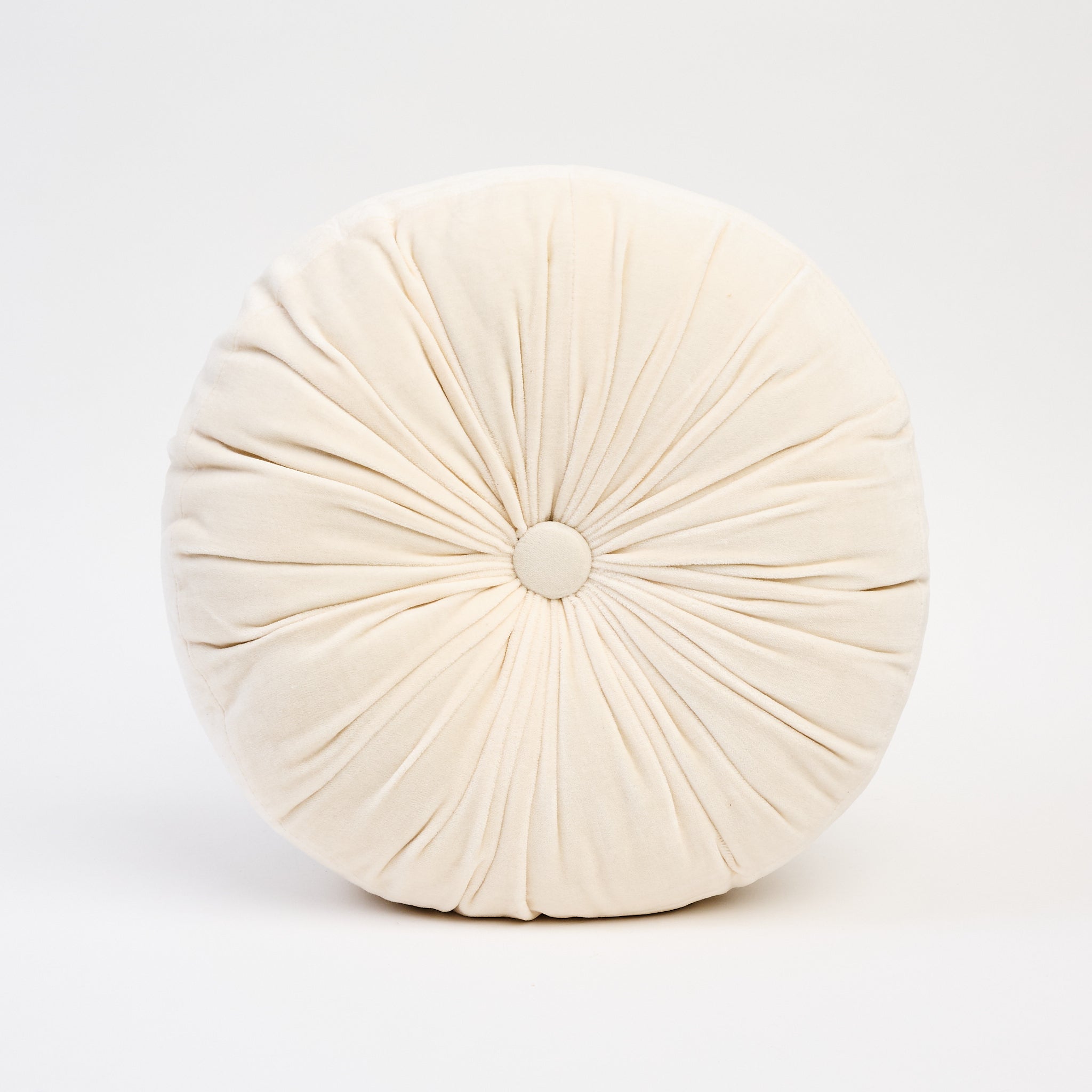 Velvet Tuft Round Cushion in Ivory on a white background at Addison West