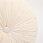 Velvet Tuft Round Cushion in Ivory on a white background at Addison West