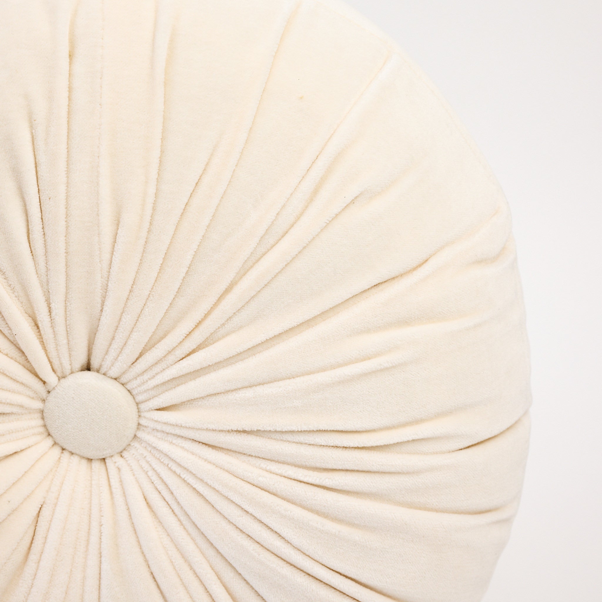 Velvet Tuft Round Cushion in Ivory on a white background at Addison West