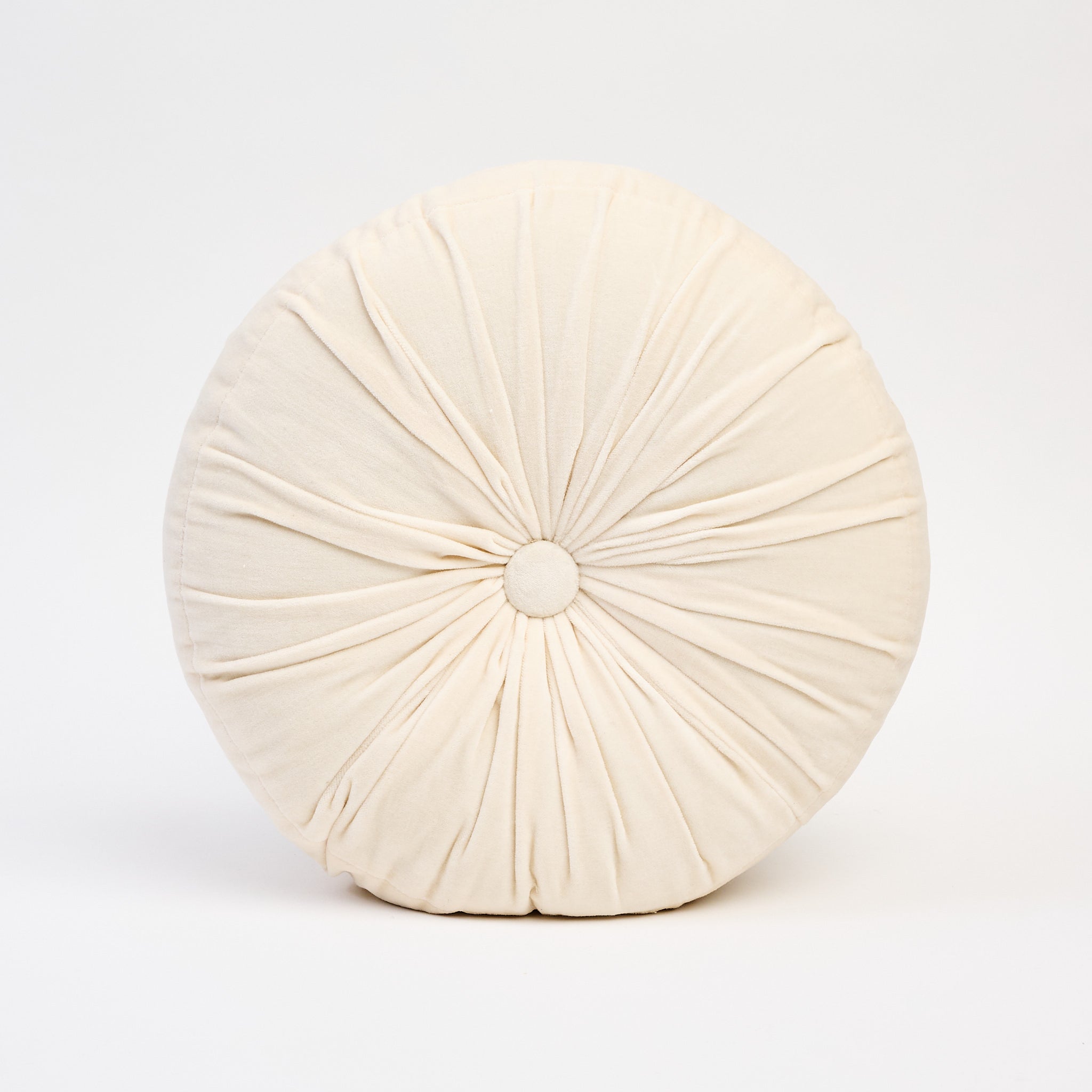 Velvet Tuft Round Cushion in Ivory on a white background at Addison West