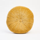 Velvet Tuft Round Cushion in Gold on a white background at Addison West