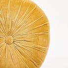 Velvet Tuft Round Cushion in Gold on a white background at Addison West