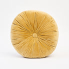Velvet Tuft Round Cushion in Gold on a white background at Addison West