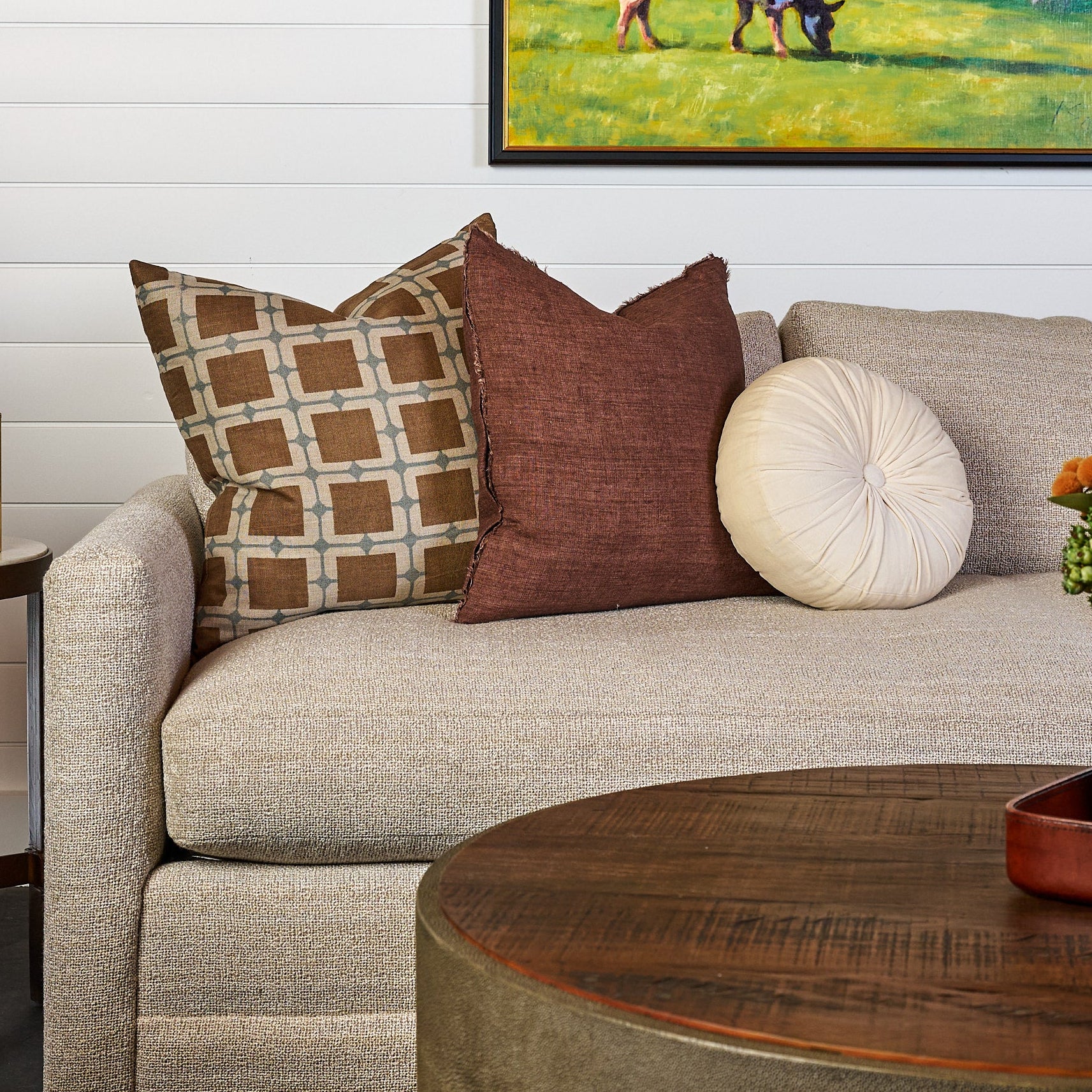 Velvet Tuft Round Cushion in Ivory and Zara Pillow 22" on a sofa at Addison West