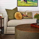 Velvet Tuft Round Cushion in Gold and Lina Linen 24" Square Pillow in Kelp and Pheasant Hand Hooked Pillow on a sofa at Addison West