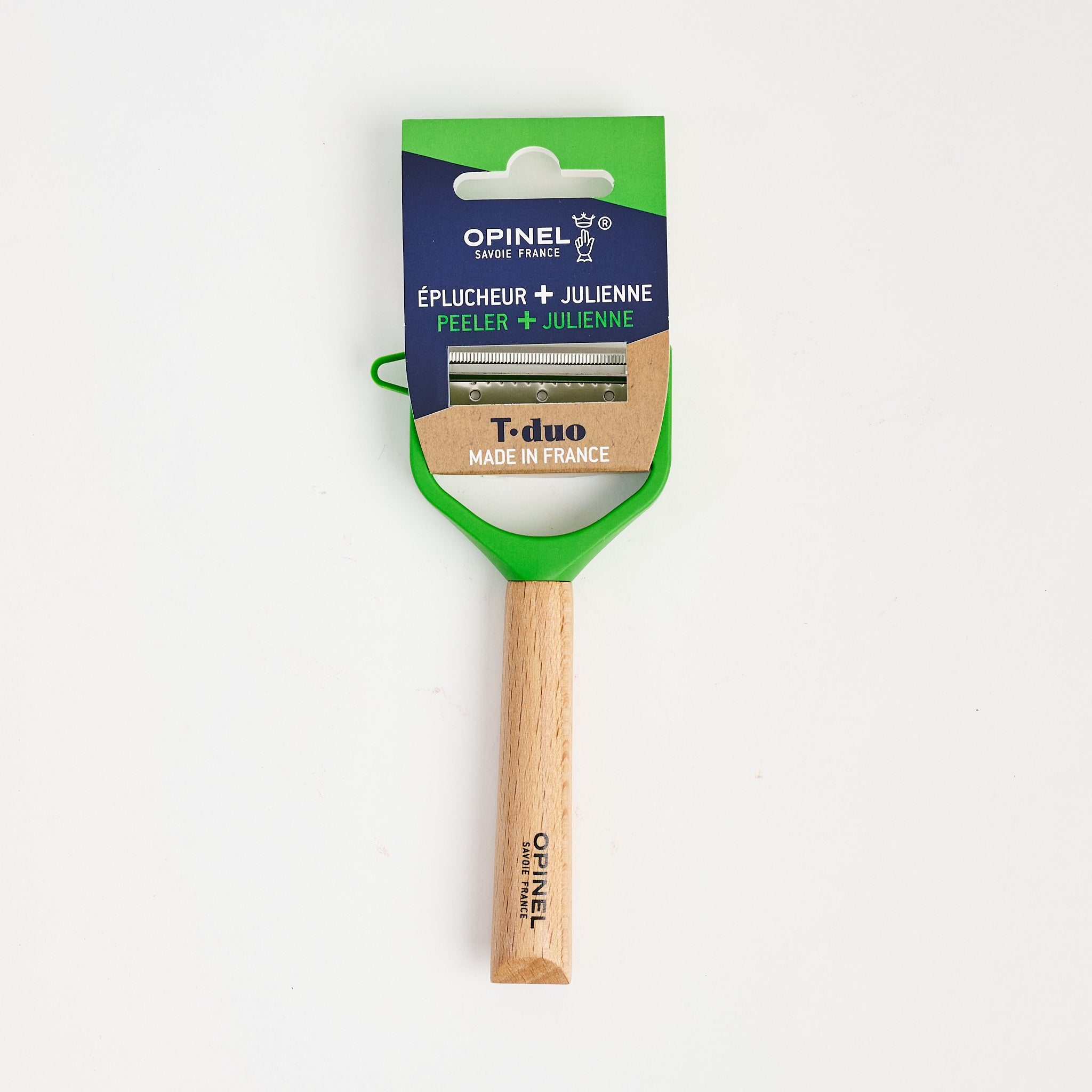 Opinel T-DUO Peeler Wood Handle in Green on a white background at Addison West