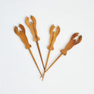 Teak Lobster Picks, Set of 4 on a white background at Addison West