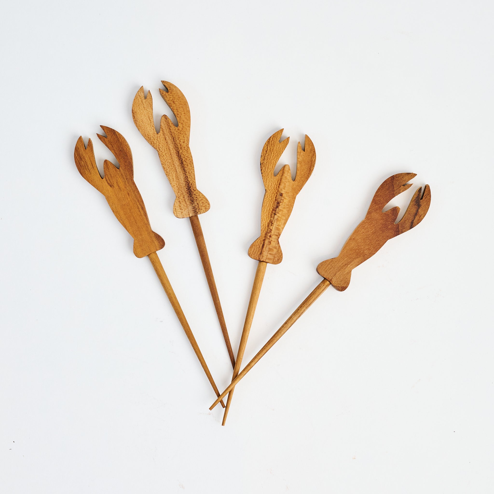 Teak Lobster Picks, Set of 4 on a white background at Addison West