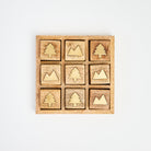 Mountain vs. Trees Tic Tac Toe Board on a white background at Addison West