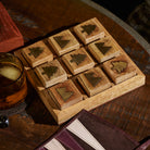 Mountain vs. Trees Tic Tac Toe Board on a dark wood coffee table at Addison West